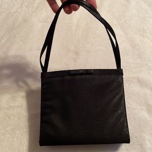 Kenneth Cole New York small satin mini bag.